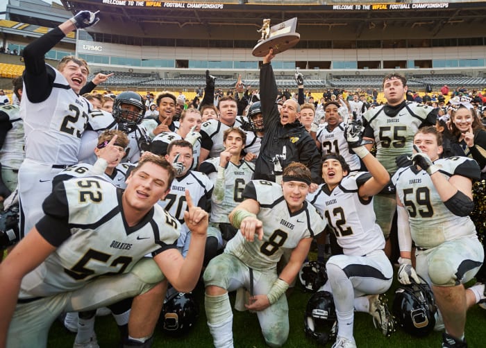 Quaker Valley hoist the trophy.